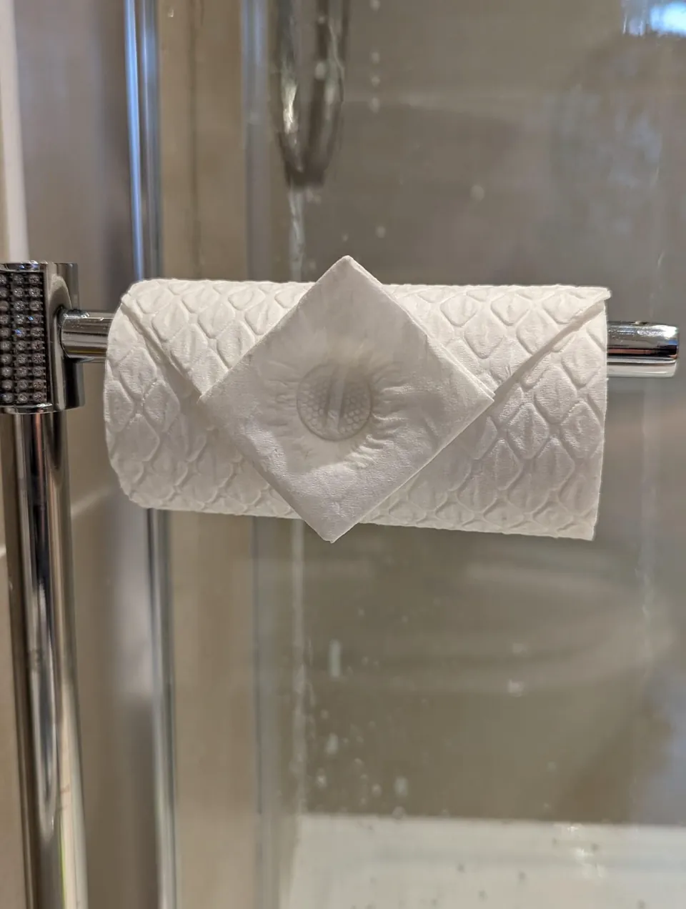 A toilet roll finished with a folded paper bow, one of the Polka Dot Cleaners finishing touches